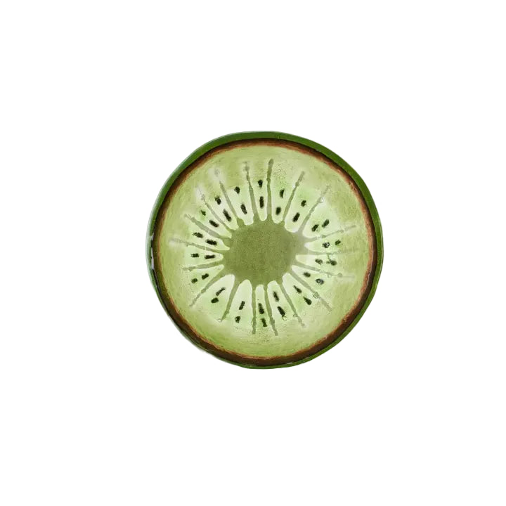 Bovenaanzicht groen schaaltje van glas met kiwipatroon op een witte achtergrond.
